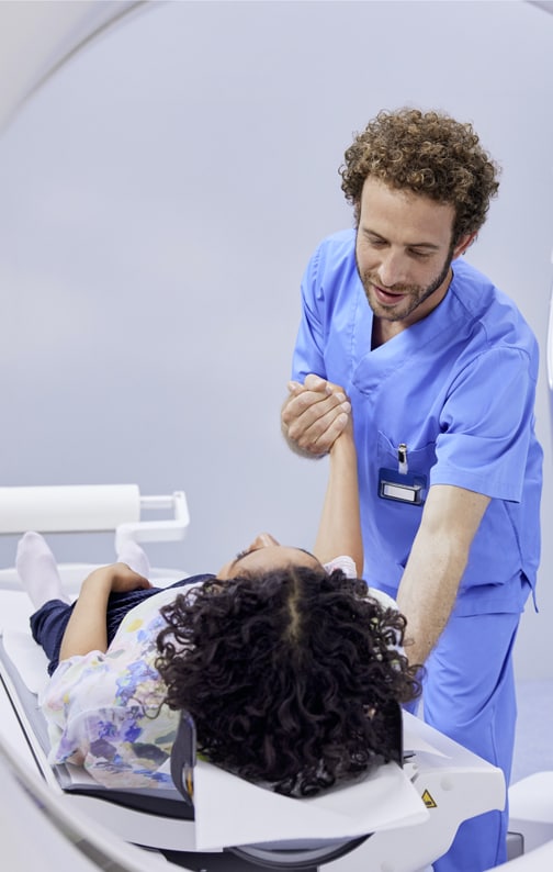 Radiographer preparing patient for scan