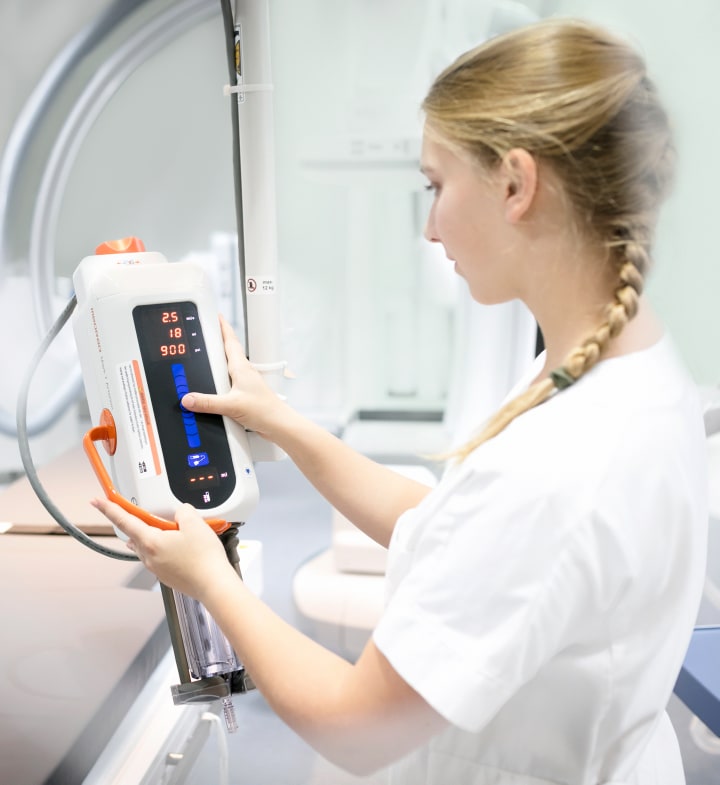 Woman using the Medrad<sup>®</sup> Mark 7 Arterion injector